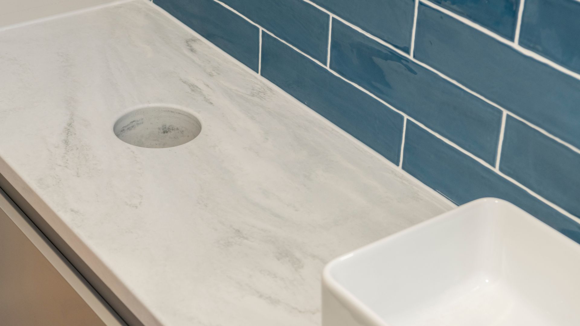 Solid Surface Vanity with Integrated Bin Chute