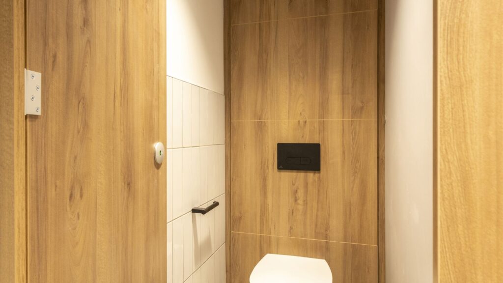 Universal Toilet with full height duct panels.