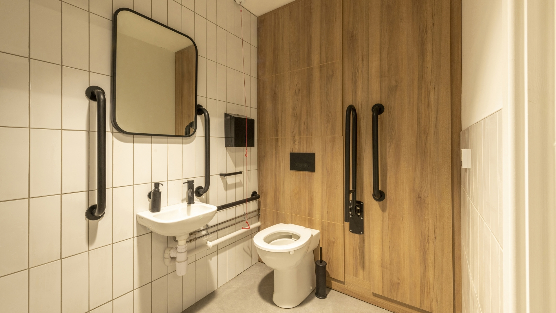 Accessible toilet with full height wood effect duct panels