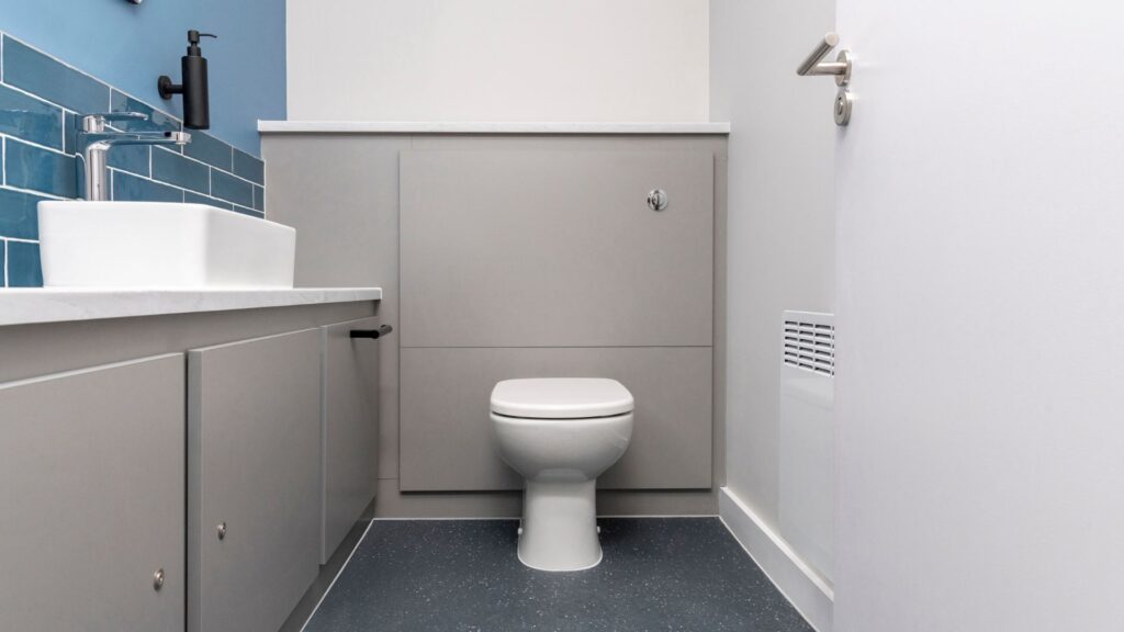Universal Toilet with half-height duct panels.