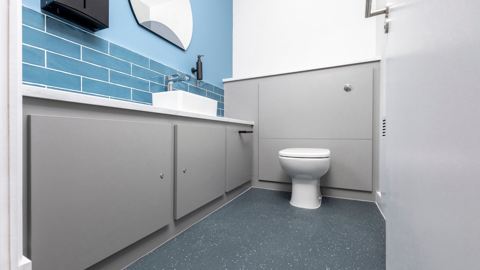 Universal Toilet with half-height duct panels.